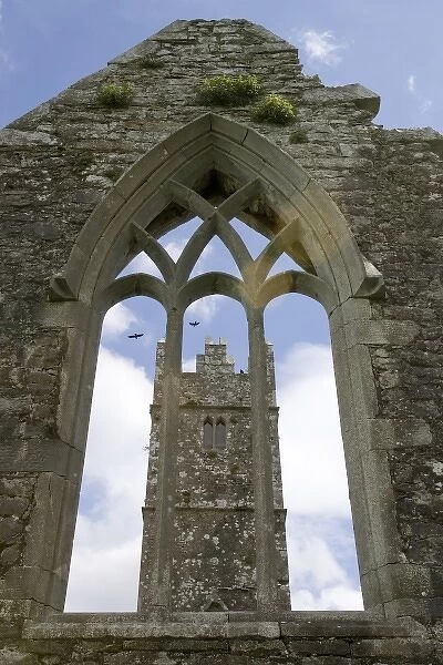 Ireland, Galway. Ross Errilly Friary bell tower viewed through an arched window