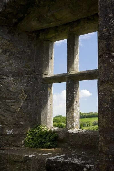 Ireland, Mayo, Turlough. Looking out of a stone church window to the Irish countryside