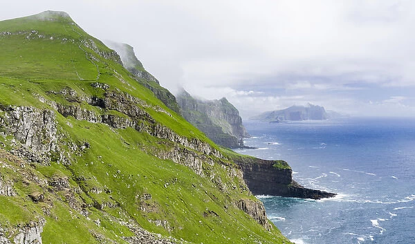 The island Mykines, in the background the island Vagar, part of the Faroe Islands