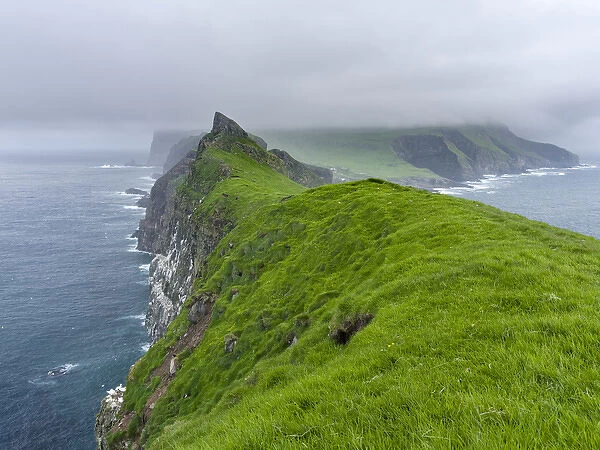 The island Mykines, seen from Mykinesholmur, part of the Faroe Islands in the North Atlantic