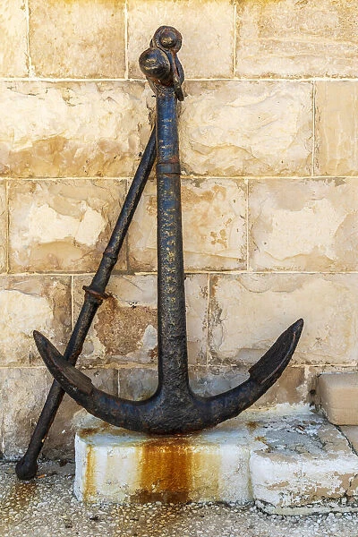 Italy, Apulia, Metropolitan City of Bari, Giovinazzo. Old rusted anchor in front of a