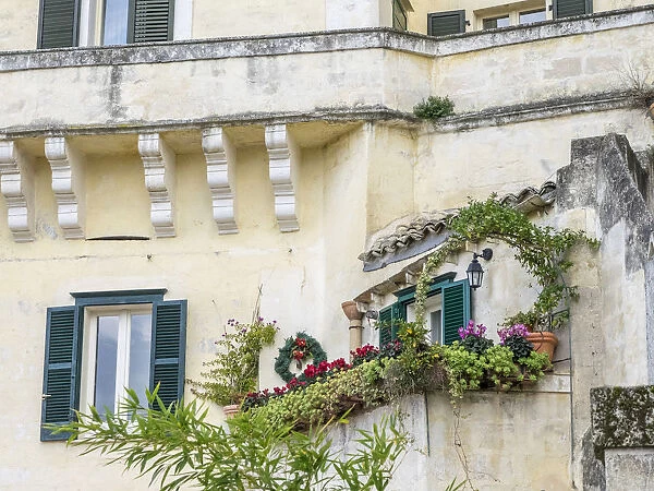 Italy, Basilicata, Matera. Plants adorn the outside walls of the Sassi houses