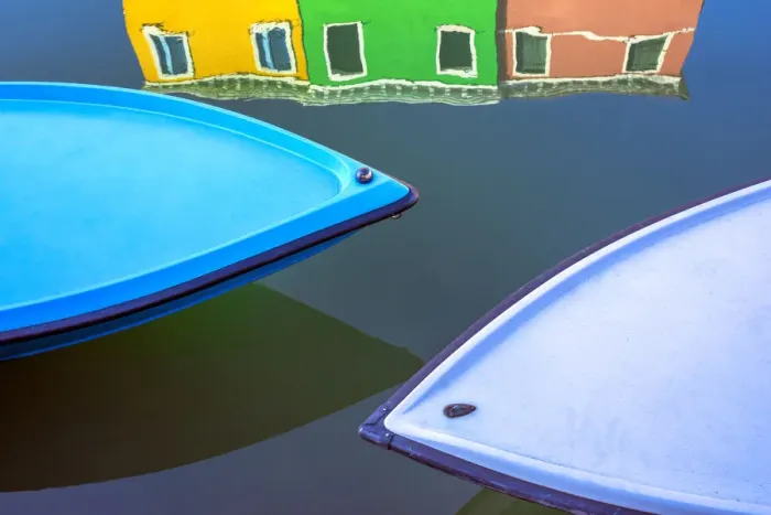 Framed Print : Italy, Burano. Boat bows and house reflection in canal