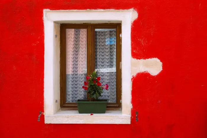 Framed Print : Italy, Burano. Colorful house wall and window