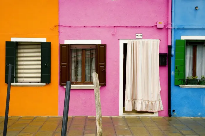 Framed Print : Italy, Burano. Colorful house windows and walls