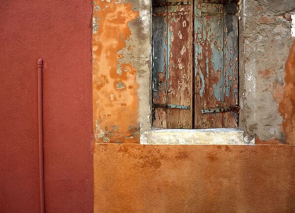 Italy, Burano. Weathered house window and wall