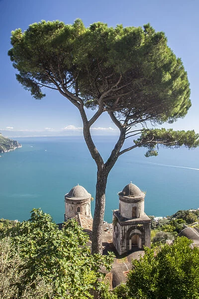 Italy, Campania, Ravello. View of the Amalfi Coast and the towers of Villa Rufolo in the hilltop town of Ravello