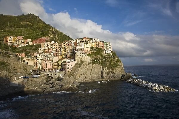 Italy, Cinque Terre, Manarola. Village on cliff in afternoon light