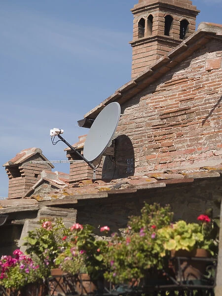 Italy, Cortona, Satelite TV dishes contrast with older houses