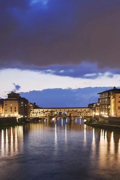 Italy, Florence. Stormy sky over the Ponte Vecchio bridge that spans the Arno River