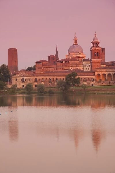Italy, Mantua Province, Mantua. Town view and Palazzo Ducale from Lago Inferiore, dawn