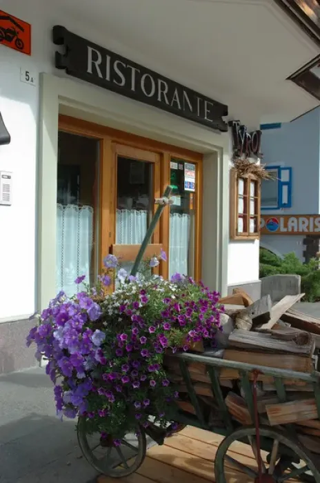 Framed Print : 04. Italy, Moena, restaurant flowers in alpine village (Editorial Usage Only)