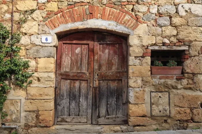 Framed Print : Italy, Monteriggioni. Stone wall, wooden door with planted geraniums Framed Print : Italy, Monteriggioni. Stone wall, wooden door with planted geraniums