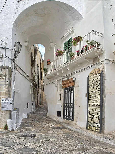Italy, Puglia, Brindisi, Itria Valley, Ostuni. The narrow alleyways of the old town of Ostuni