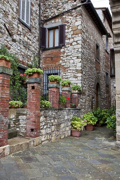 Italy, Radda in Chianti. Entrance to homes along the streets of Radda in Chianti
