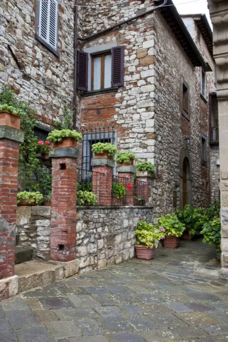 Framed Print : Italy, Radda in Chianti. Entrance to homes along the streets of Radda in Chianti