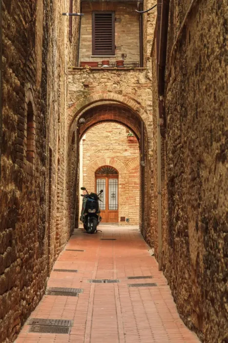 Framed Print : Italy, San Gimignano. Alleyway with motorbike Framed Print : Italy, San Gimignano. Alleyway with motorbike
