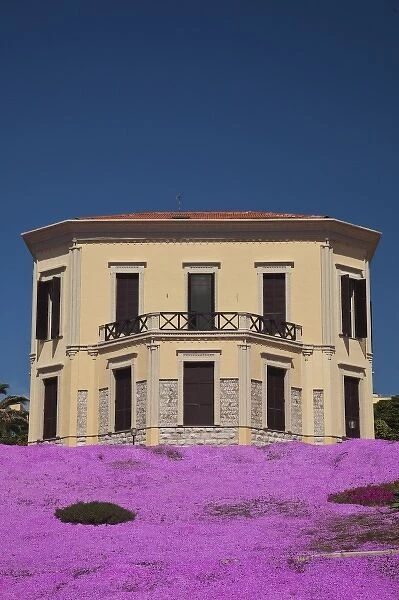 Italy, Sardinia, Alghero. Beachside villa and flowers