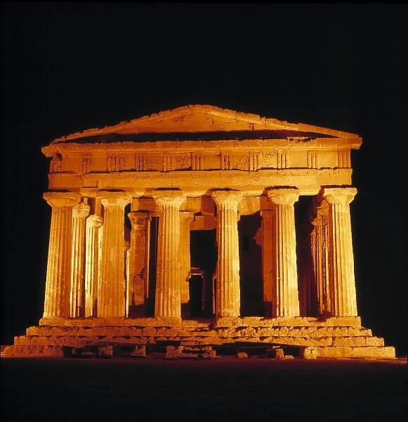Italy, Sicily, Agrigento. Flood-lights emphasize the classic lines of the Temple