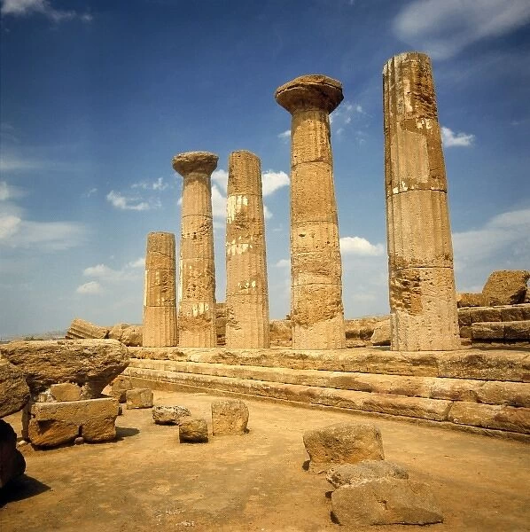 Italy, Sicily, Agrigento. The ruins of the Temple of Hercules rise mightily against