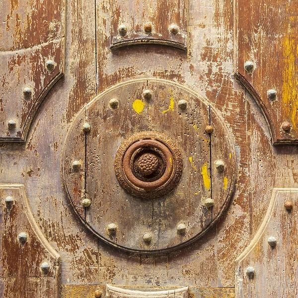 Italy, Sicily, Palermo Province, Cefalu. Detail of an exterior wooden door on the Cefalu