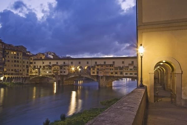 Italy, Tuscany, Florence. Ponte Vecchio bridge, built in 1345, spans the Arno River