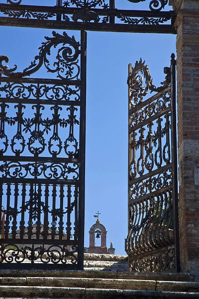 Italy, Tuscany, Montepulciano. The wrought iron gate leading to the cemetery near the Church of San Biaggio