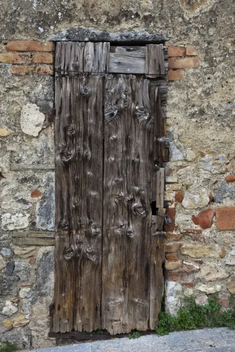 Framed Print : Italy, Tuscany, Monteriggioni. Old doorway in the walled town of Monteriggioni