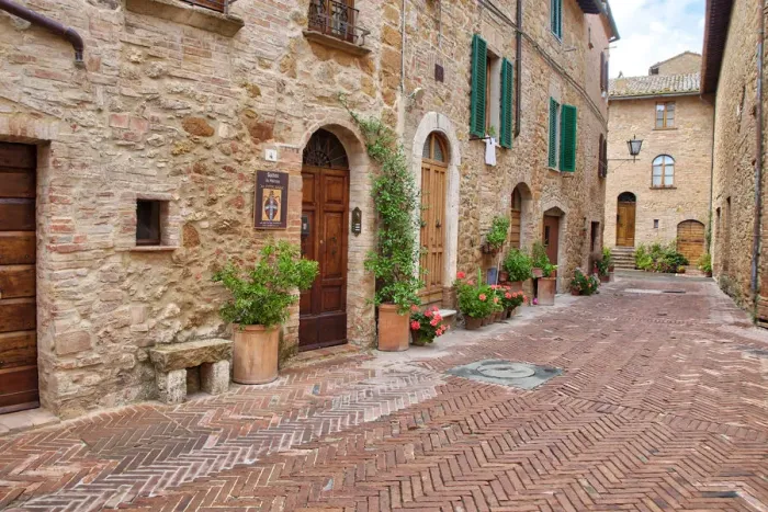 Framed Print : Italy, Tuscany, Pienza. Flower pots and potted plants decorate a narrow street in a Tuscany village Framed Print : Italy, Tuscany, Pienza. Flower pots and potted plants decorate a narrow street in a Tuscany village