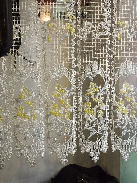 Italy, Tuscany, Province of Siena, Montalcino. Pretty lace curtains