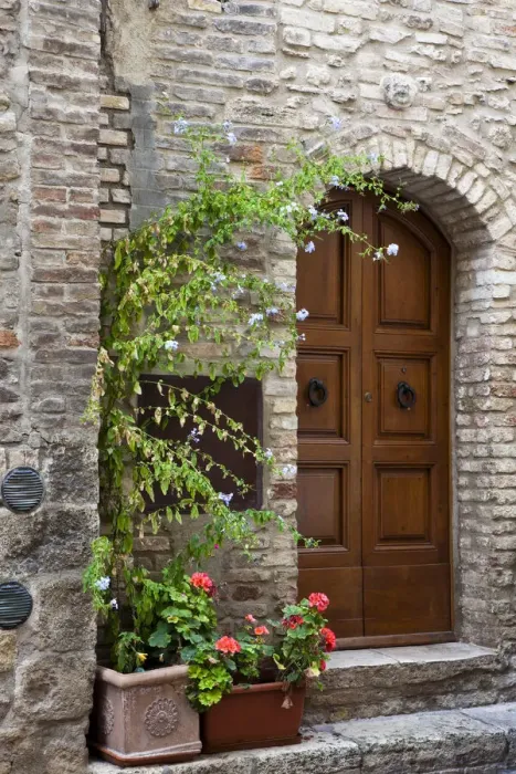 Framed Print : Italy, Tuscany, San Gimignano. Homes decorated with flower pots along the streets of San Gimignano Framed Print : Italy, Tuscany, San Gimignano. Homes decorated with flower pots along the streets of San Gimignano