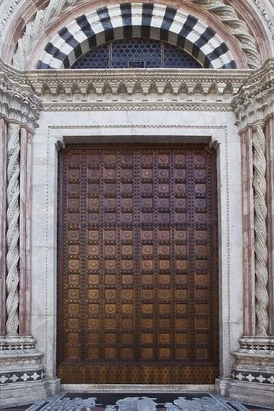 Italy, Tuscany, Siena. Close-up of front door to the Duomo or local cathedral