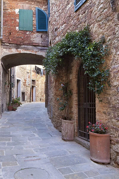 Italy, Tuscany. Street scene in the medieval village of Lucignano