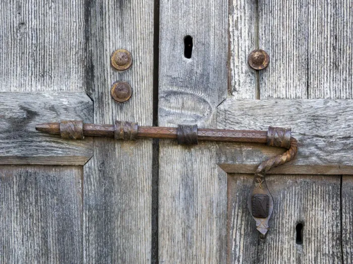 Framed Print : Italy, Tuscany. Unique metal door lock on an old wooden door