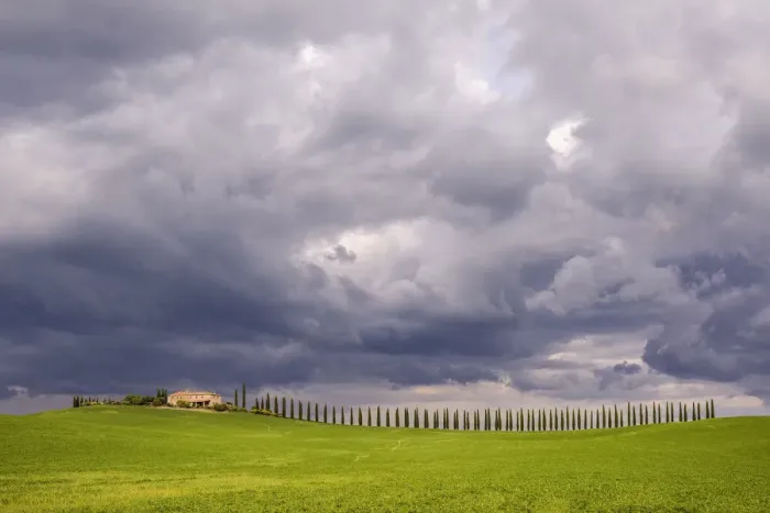 Framed Print : Italy, Tuscany, Val d Orcia. Farmhouse and storm clouds at sunset