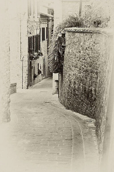 Italy, Umbria. Vintage look of a street in the historic town of Montone