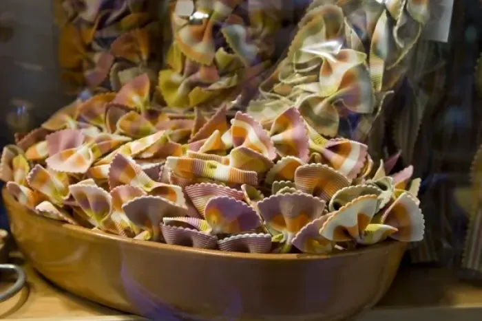 Framed Print : Italy, Venice. A bowl of colorful pasta bow ties