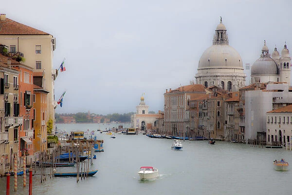 Italy, Venice. Buildings along the Grand Canal with Santa Maria della Salute beyond