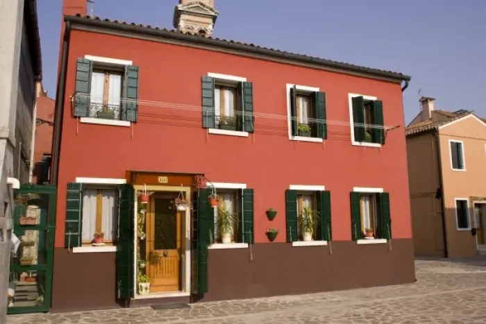 Framed Print : Italy, Venice, Burano. A bright orange house with green shutters Framed Print : Italy, Venice, Burano. A bright orange house with green shutters