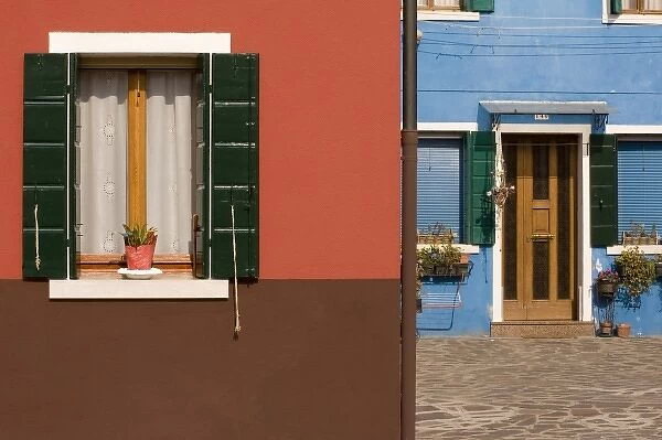 Italy, Venice, Burano. Contrast of colorful windows, door and walls