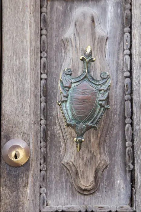 Framed Print : Italy, Venice, Burano Island. Closeup of brass detail on an old wooden door on Burano Island