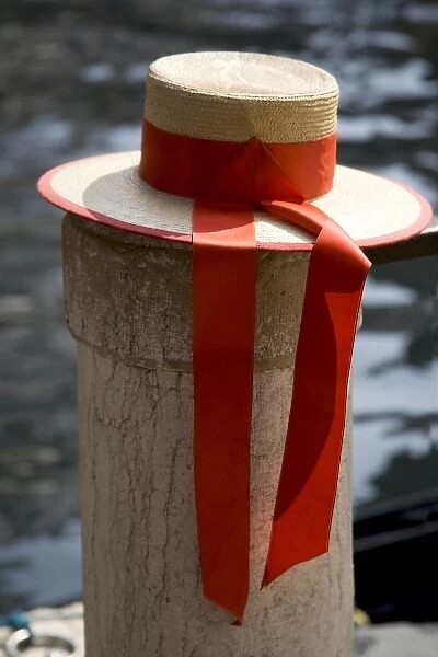 Italy, Venice. Close-up of colorful gondoliers hat on piling