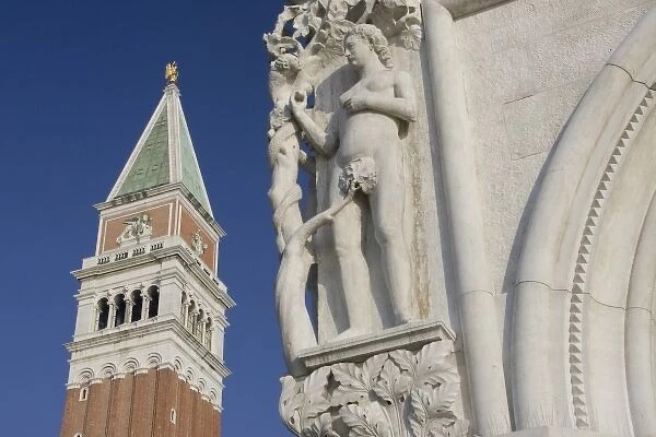 Italy, Venice. Corner statue of Doges Palace and Campanile