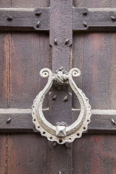 Italy, Venice. Door knocker on an old door along the streets of Venice