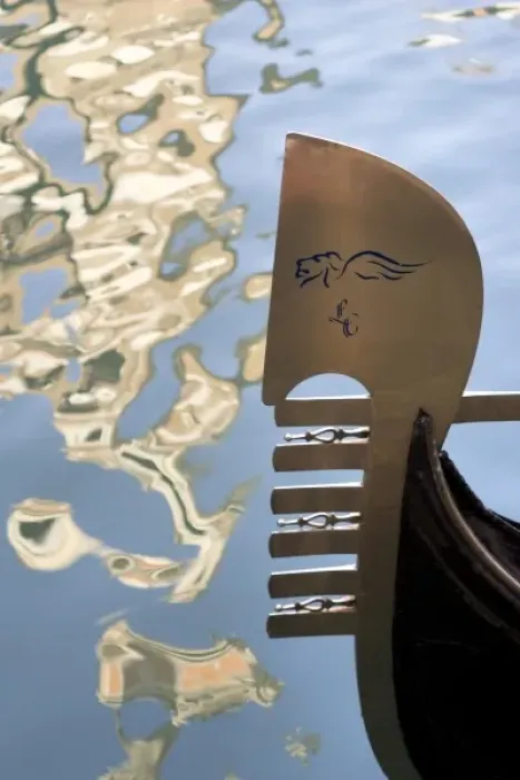 Framed Print : Italy, Venice. Gondola bow and water reflection