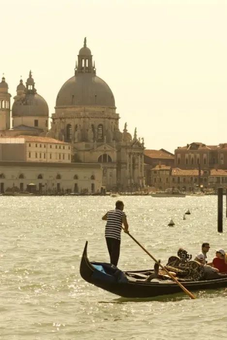 Framed Print : Italy; Venice. A gondolier ferries tourists on the Grand Canal in Venice with the massive church Framed Print : Italy; Venice. A gondolier ferries tourists on the Grand Canal in Venice with the massive church