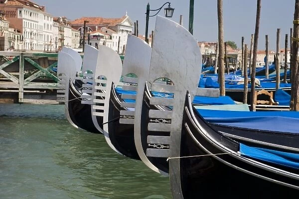 Italy, Venice. Prows of a row of gondolas near San Marco Square