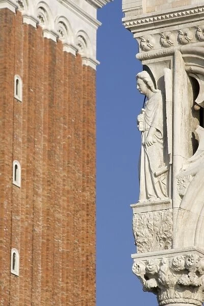 Italy, Venice. A statue on the corner of the Doges Palace with part of St. Mark s