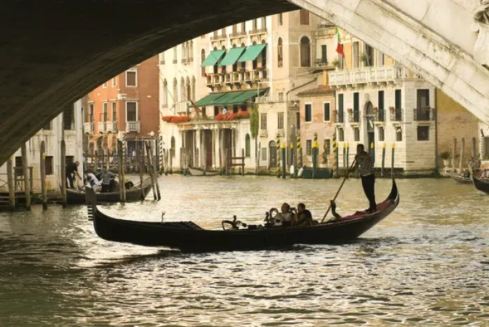 Framed Print : Italy; Venice. Tourist take snap shots from a gondola as they pass under the Rialto Framed Print : Italy; Venice. Tourist take snap shots from a gondola as they pass under the Rialto