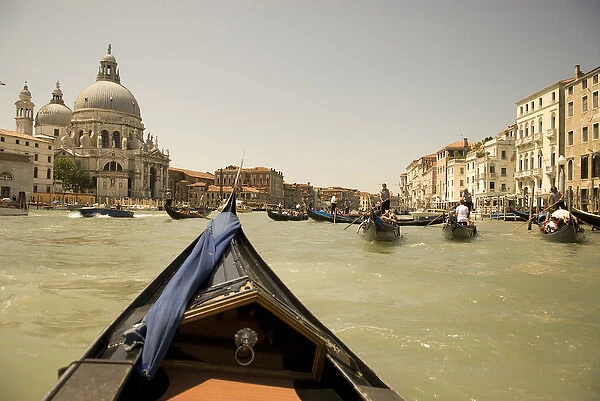 Italy; Venice. Tourists ride in gondolas on the Grand Canal in Venice